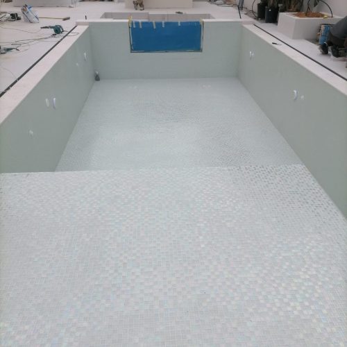 empty-pool-white-mosaic-tile-installation